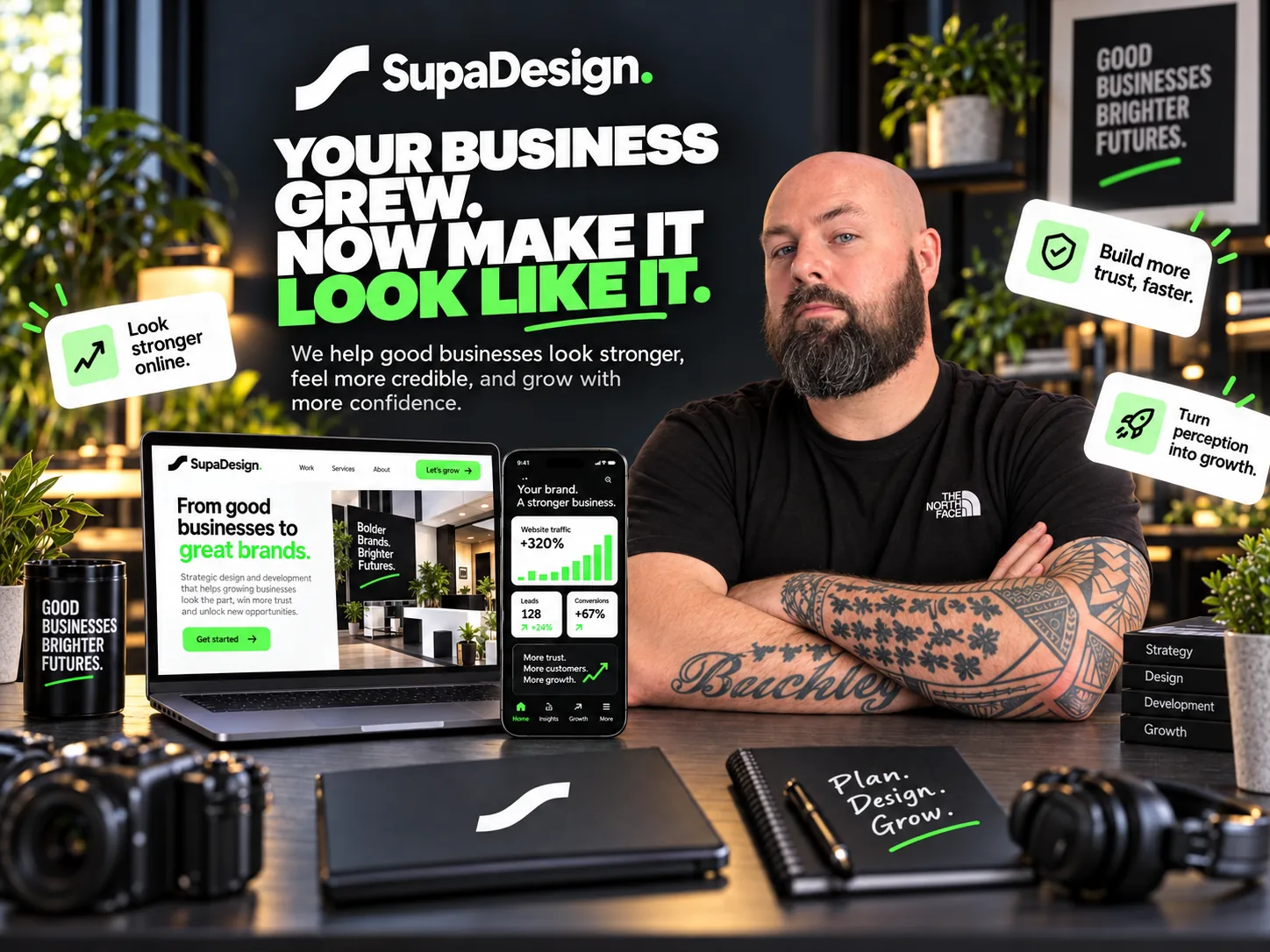 Darren Buckley at the SupaDesign studio desk with design and development work on screen