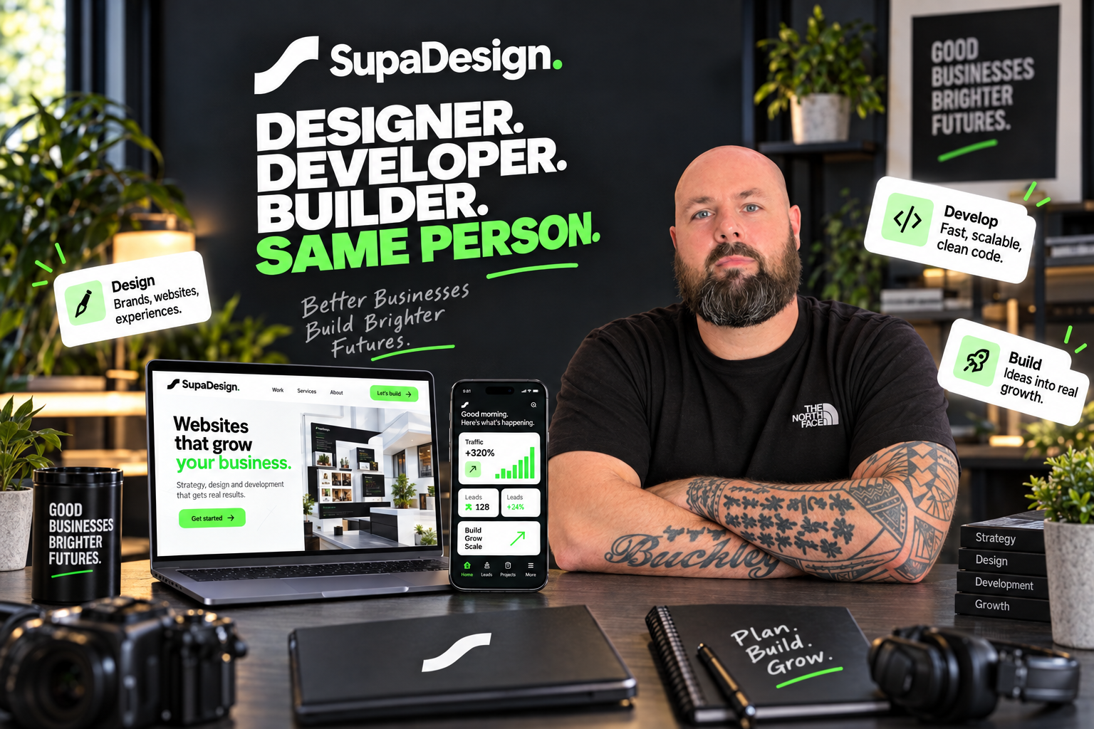 Darren Buckley at the SupaDesign studio desk with design and development work on screen
